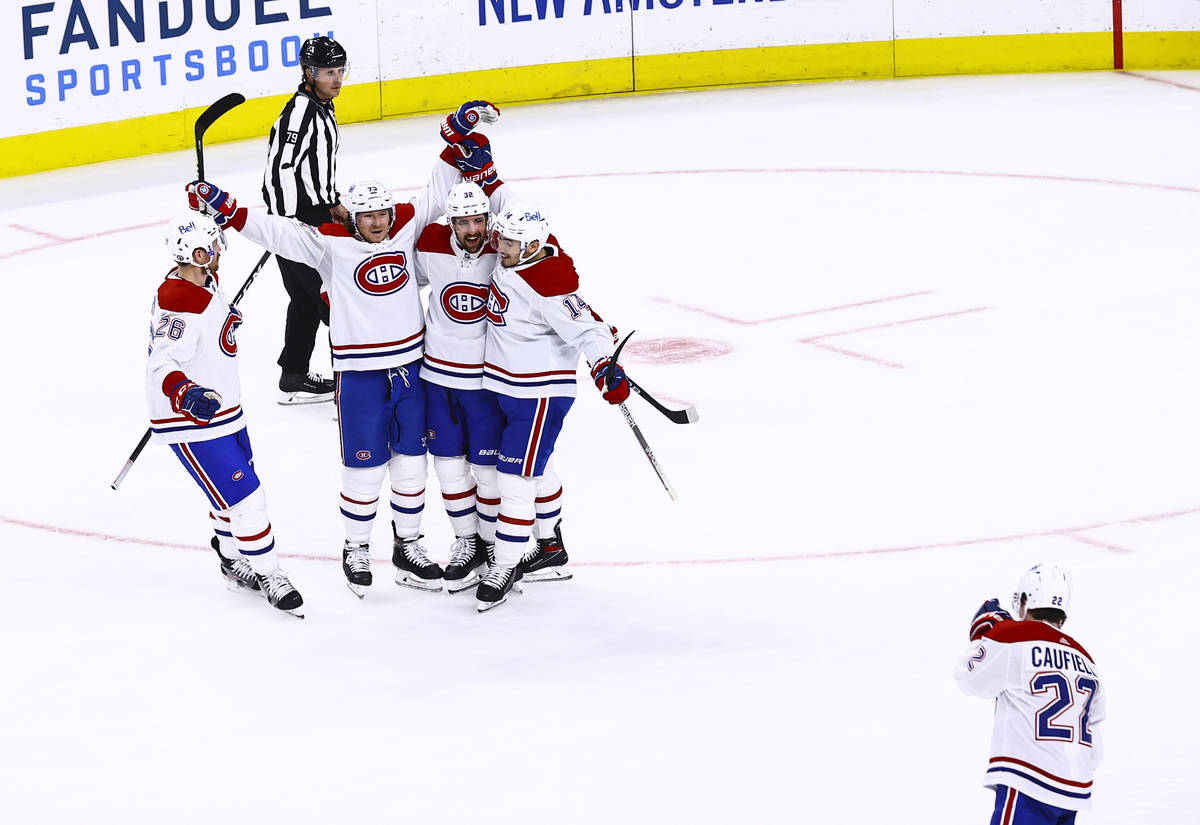 The Montreal Canadiens celebrate after scoring the second of two goals against the Golden Knigh ...