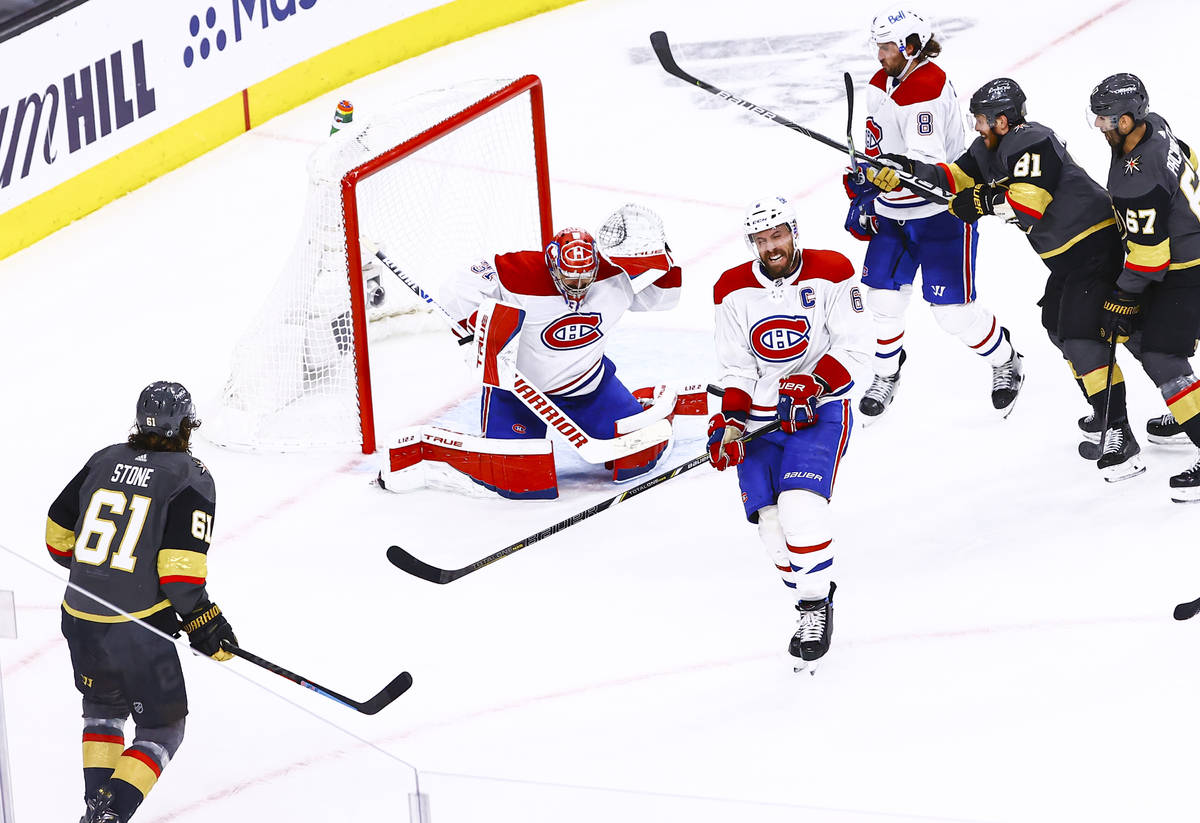 Montreal Canadiens' Shea Weber (6) blocks the puck in front of goaltender Carey Price (31) duri ...