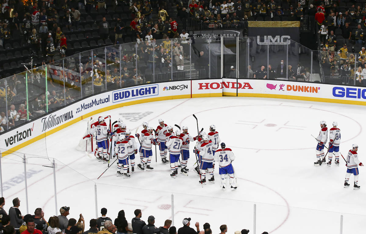 The Montreal Canadiens celebrate their 3-2 victory over the Golden Knights in Game 2 in an NHL ...