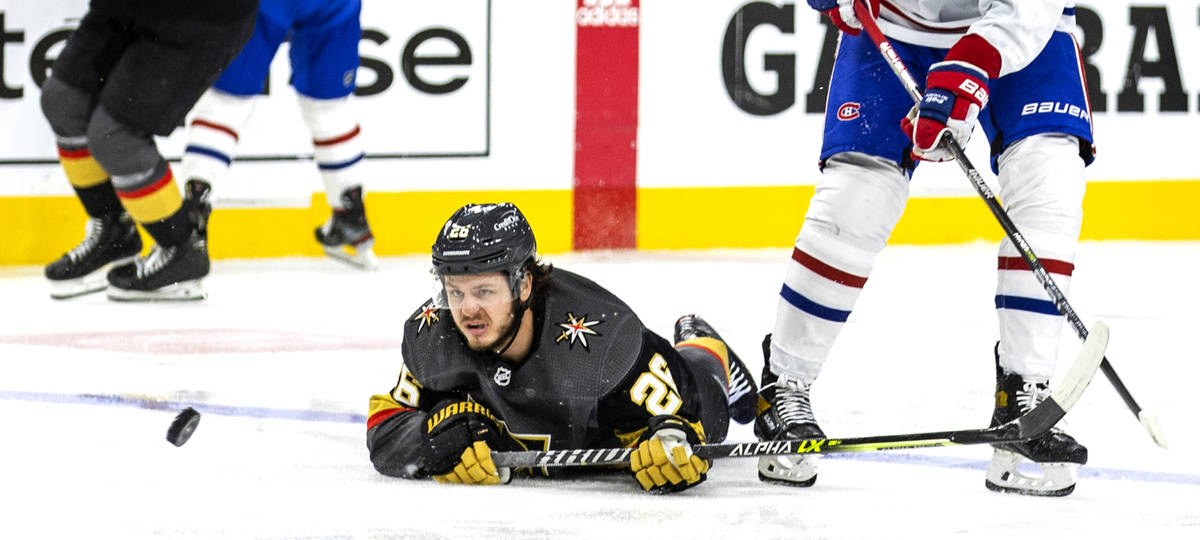 Golden Knights center Mattias Janmark (26) looks to a puck that just gets away on a drive to th ...