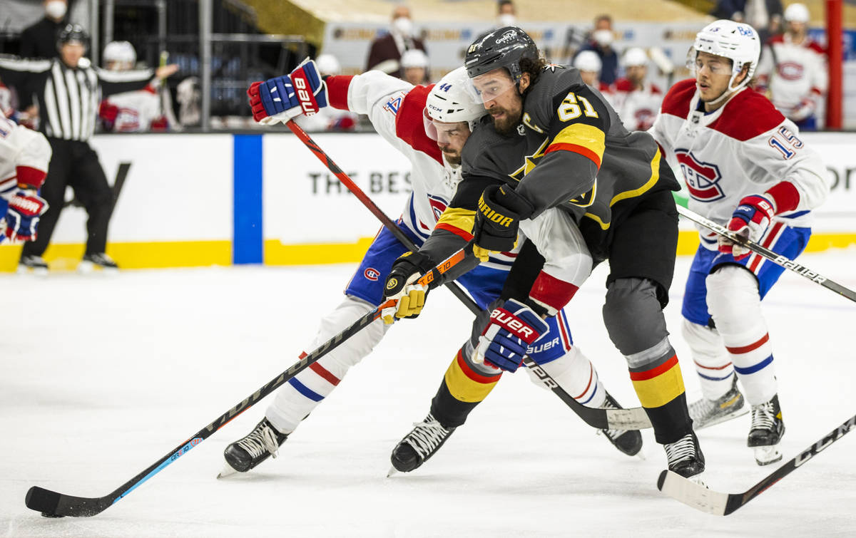 Golden Knights right wing Mark Stone (61) battles for control of the puck with Montreal Canadie ...