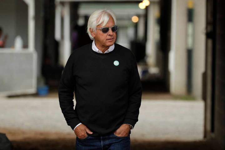 In this May 1, 2019, file photo, trainer Bob Baffert looks out from his barn before a workout a ...