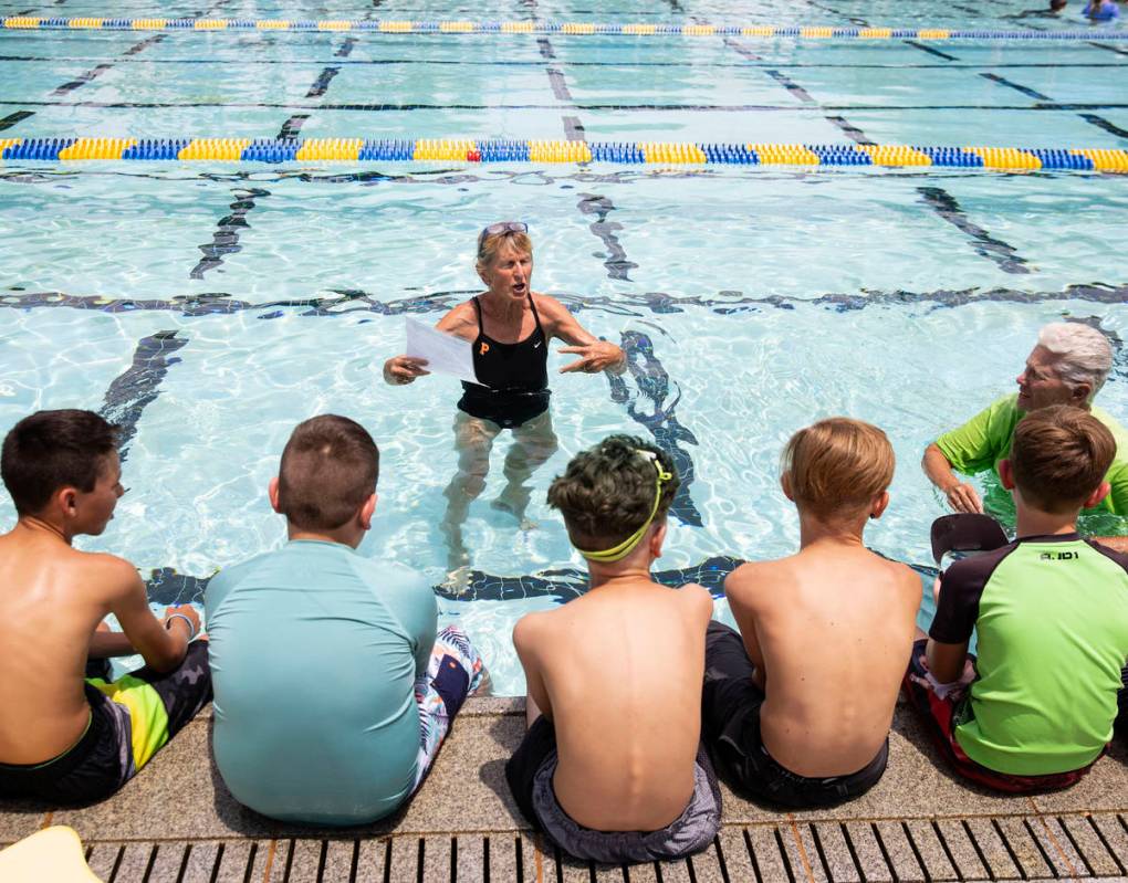 Children listen instructions from Sara Carroll, a volunteer instructor, prior to the start of t ...