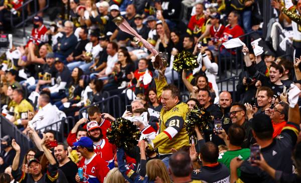 Cameron Hughes performs to hype up the crowd during the first period of Game 2 in an NHL hockey ...