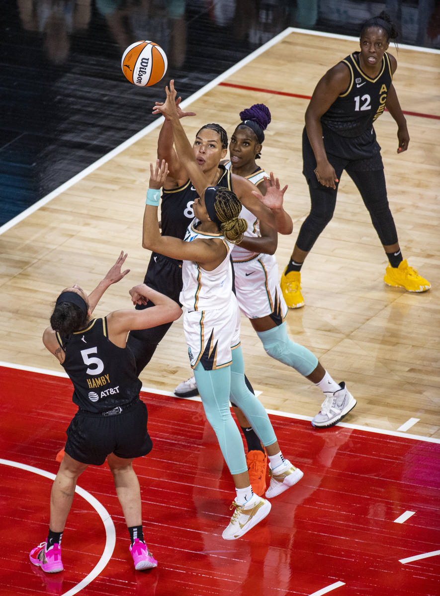 Las Vegas Aces center Liz Cambage (8) blocks a shot by New York Liberty forward Leaonna Odom (0 ...