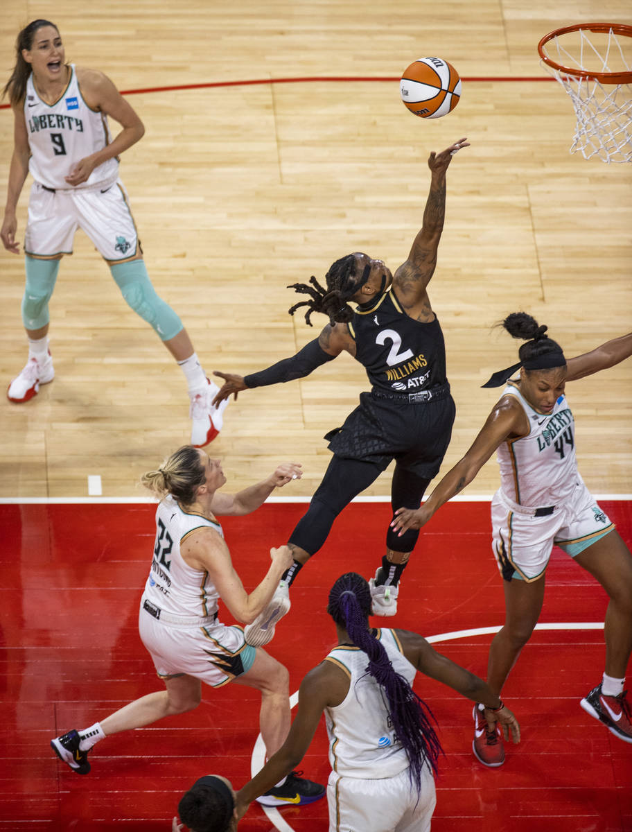 Las Vegas Aces guard Riquna Williams (2) elevates for a finger roll over New York Liberty guard ...