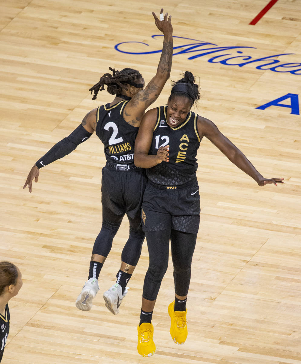 Las Vegas Aces guard Riquna Williams (2) and teammate guard Chelsea Gray (12) celebrate anothe ...