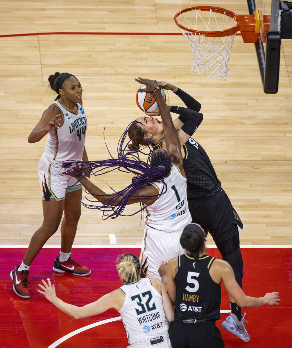 Las Vegas Aces center JiSu Park (19) shoots while fouled by New York Liberty forward Reshanda G ...