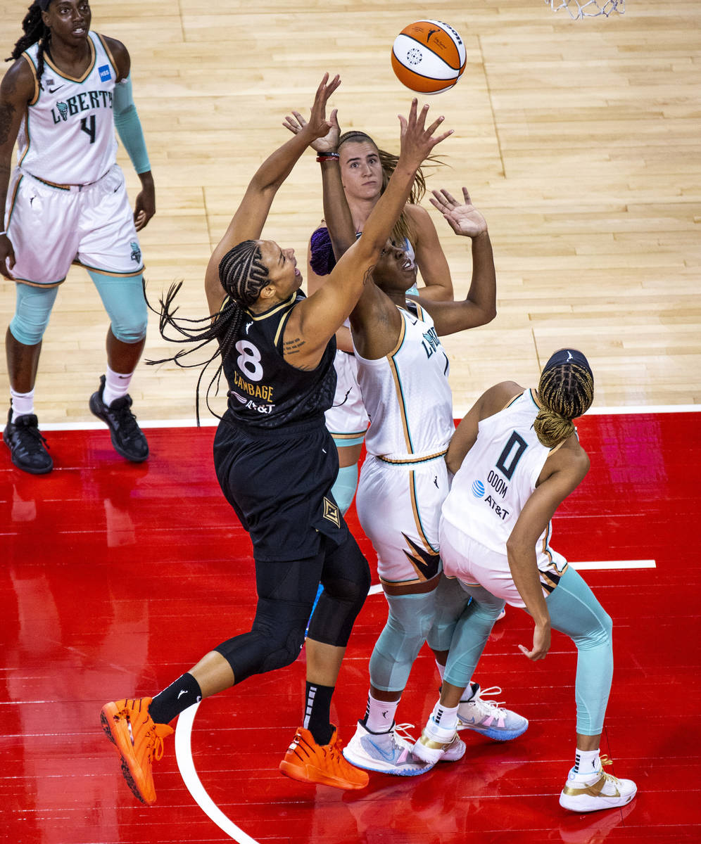 Las Vegas Aces center Liz Cambage (8) shoots to score over New York Liberty forward Reshanda Gr ...