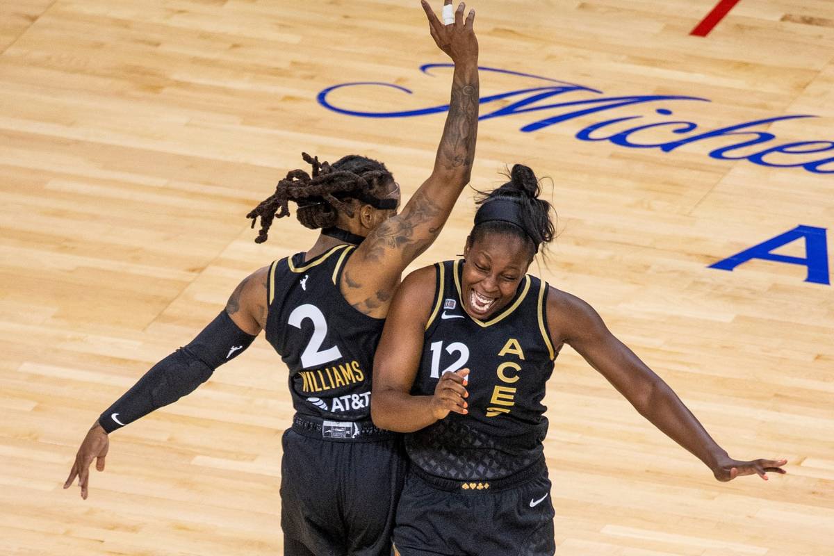 Las Vegas Aces guard Riquna Williams (2) and teammate guard Chelsea Gray (12) celebrate anothe ...