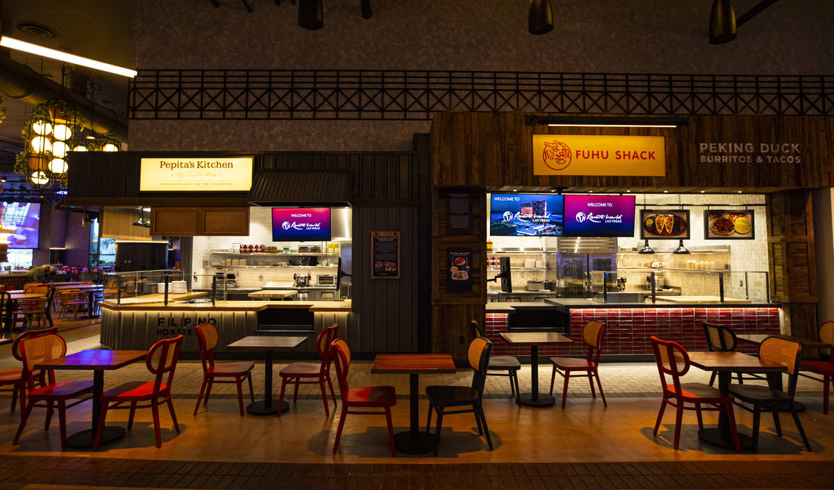 Pepita's Kitchen, left, and Fuhu Shack are seen at the Famous Foods Street Eats area during a t ...