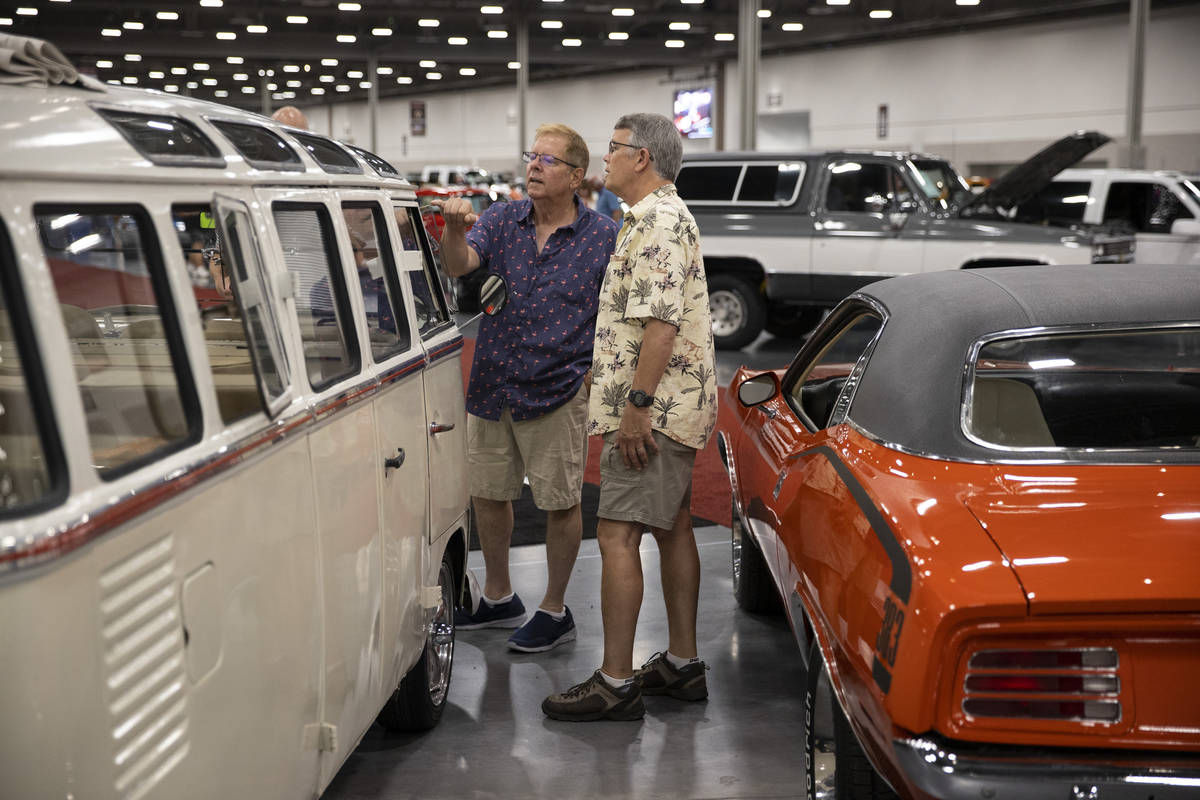 Jeff Gordon, left, and Frank Nunez, of Los Angeles, check out a 1964 Volkswagen microbus while ...