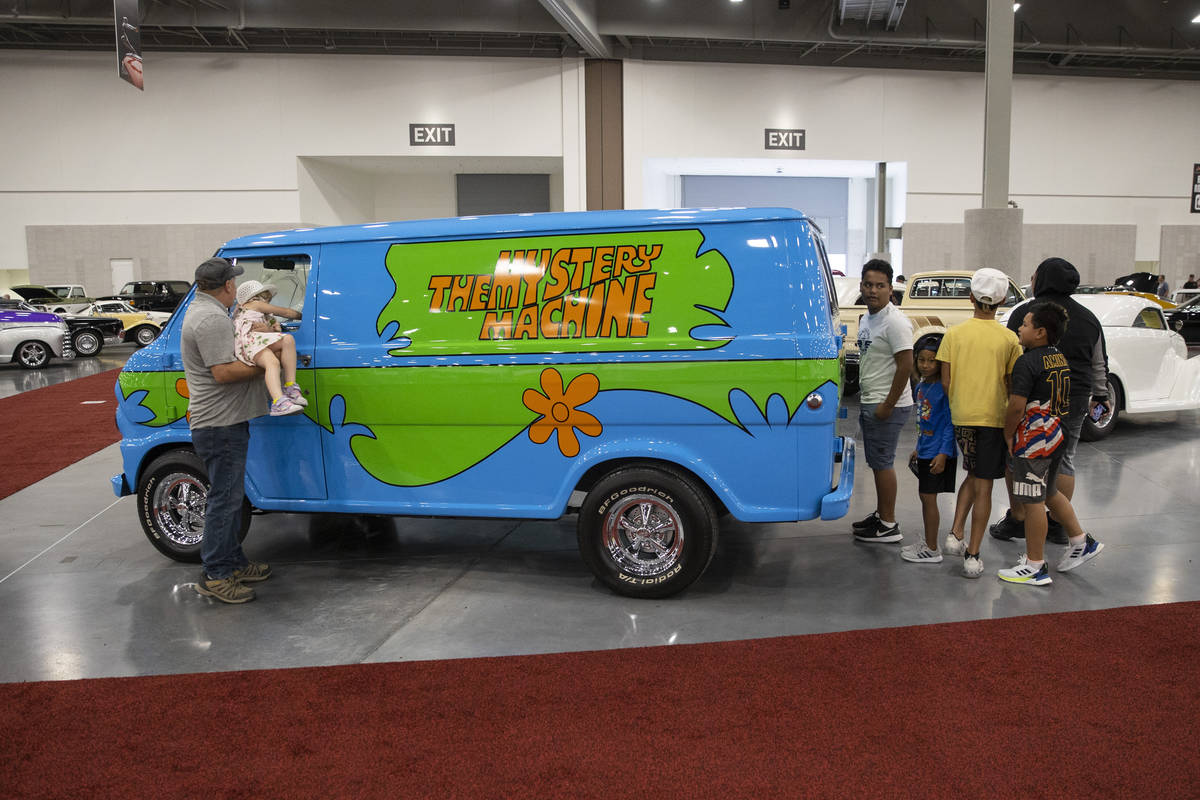 People check out the 1968 For Ecoline "Mystery Machine" van in the Barrett-Jackson au ...