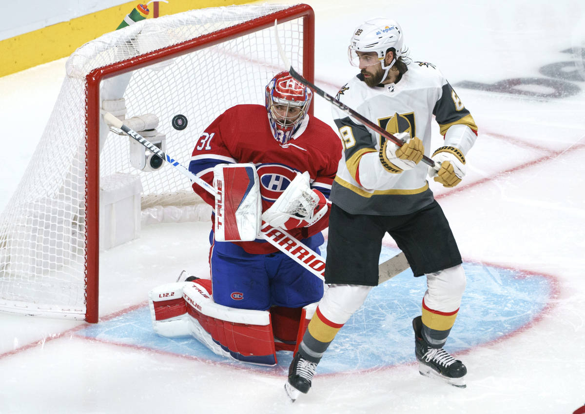 Montreal Canadiens goaltender Carey Price stops a shot as Vegas Golden Knights' Alex Tuch looks ...