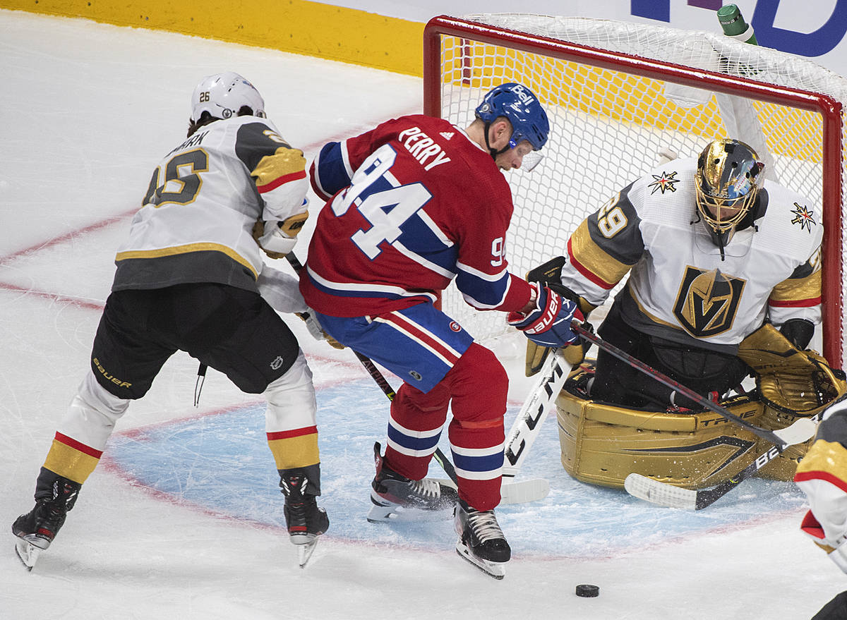 Montreal Canadiens' Corey Perry (94) moves in on Vegas Golden Knights goaltender Marc-Andre Fle ...