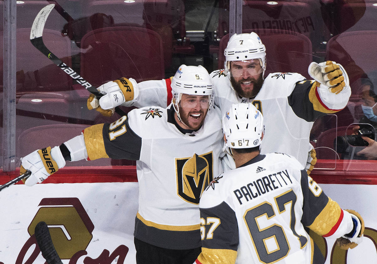 Vegas Golden Knights' Alex Pietrangelo (7) celebrates with Jonathan Marchessault (81) and Max P ...