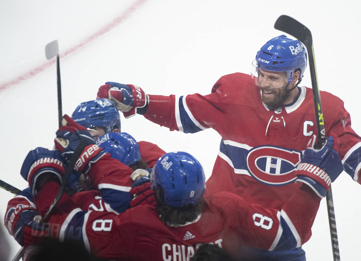 Montreal Canadiens celebrate a goal by Cole Caufield against the against Vegas Golden Knights d ...