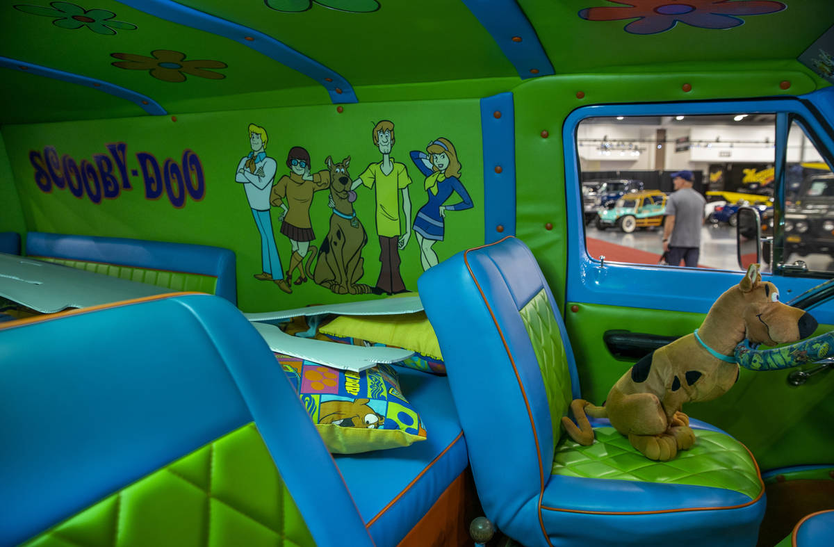 Scooby-Doo sits behind the wheel of a 1968 Ford Econoline ÒMystery MachineÓ van recre ...