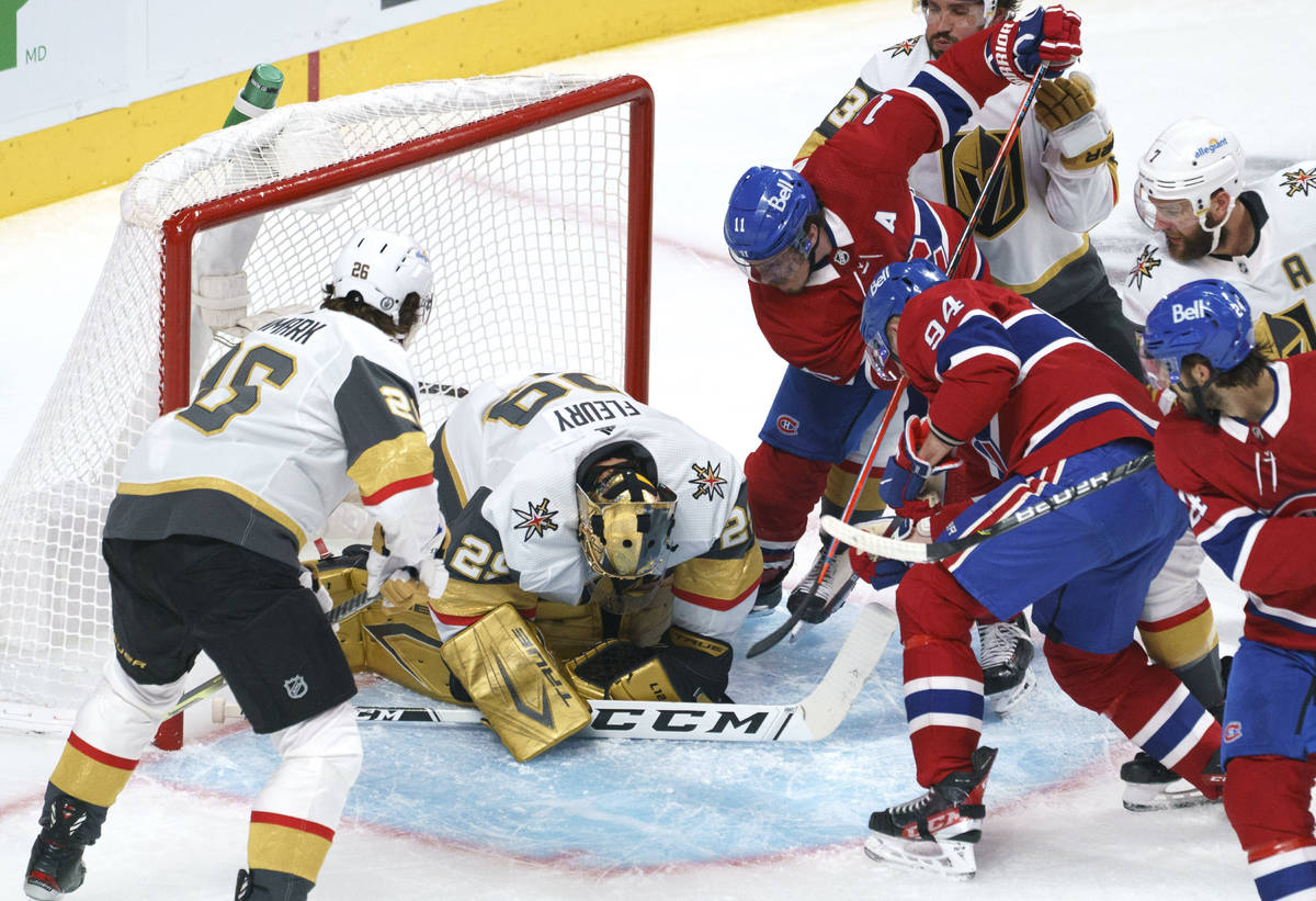 Vegas Golden Knights goaltender Marc-Andre Fleury covers the puck in front of Montreal Canadien ...