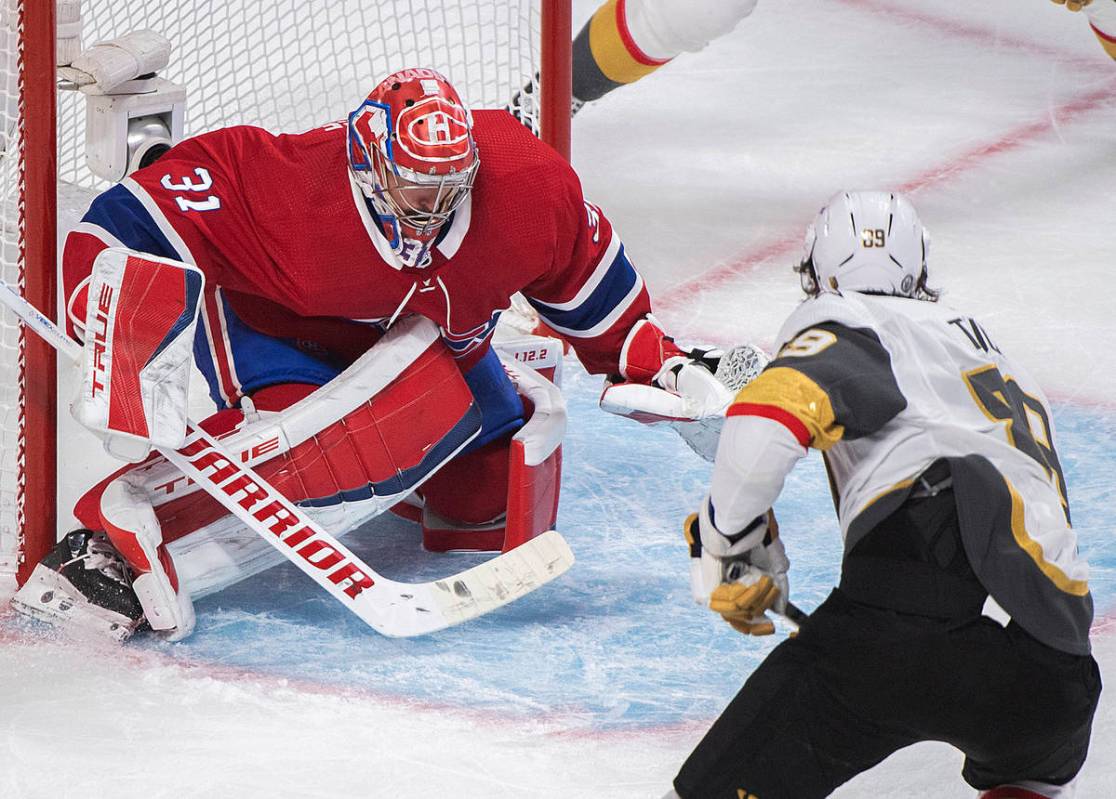 Vegas Golden Knights' Alex Tuch moves in on Montreal Canadiens goaltender Carey Price during th ...
