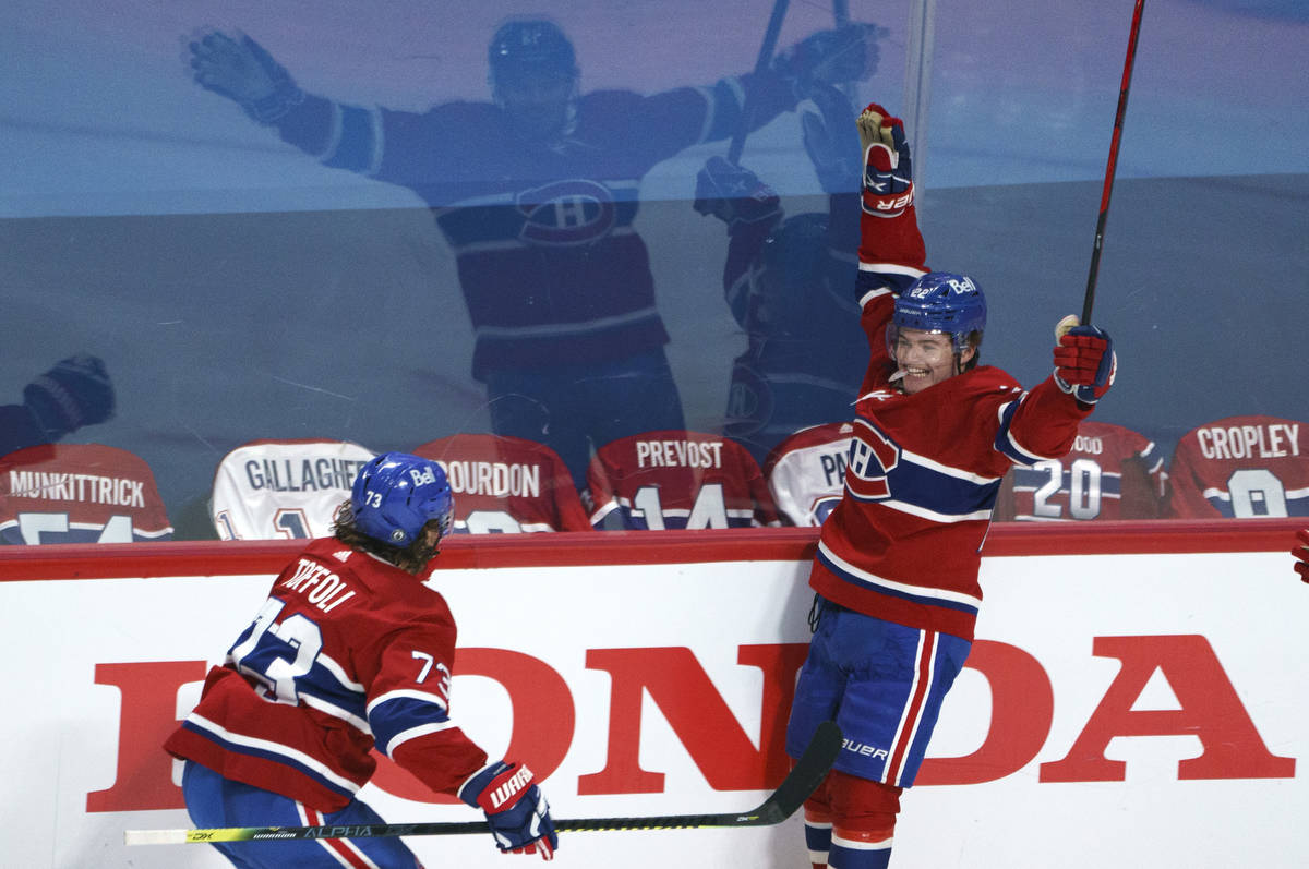 Montreal Canadiens' Cole Caufield celebrates his goal against the Montreal Canadiens with Tyler ...