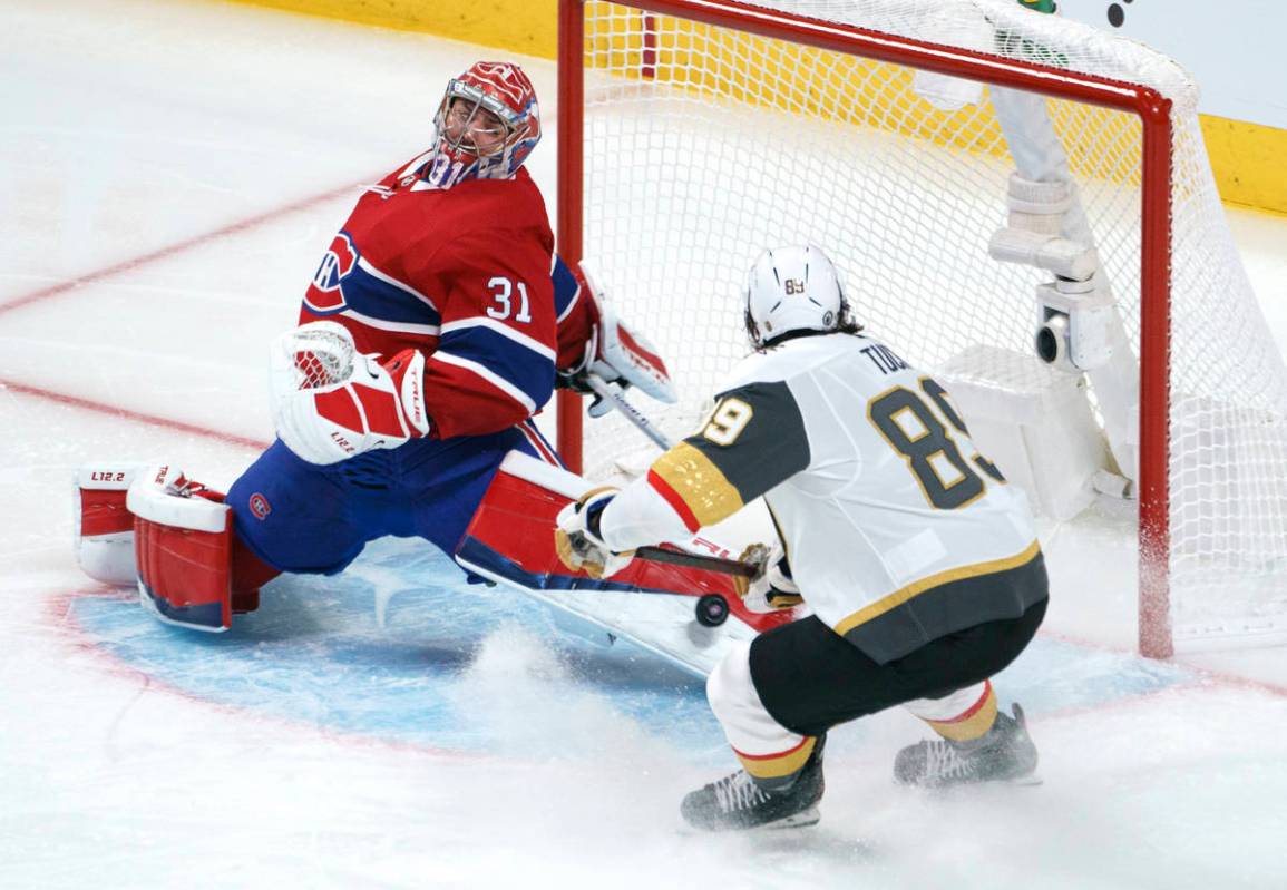 Montreal Canadiens goaltender Carey Price makes a save on Vegas Golden Knights' Alex Tuch durin ...