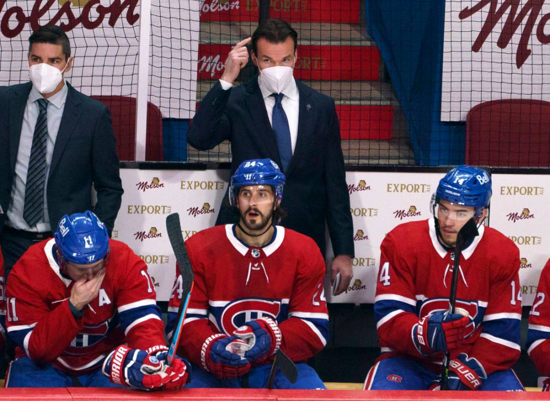 Montreal Canadiens substitute coach Luke Richardson stands behind the team bench during the fir ...