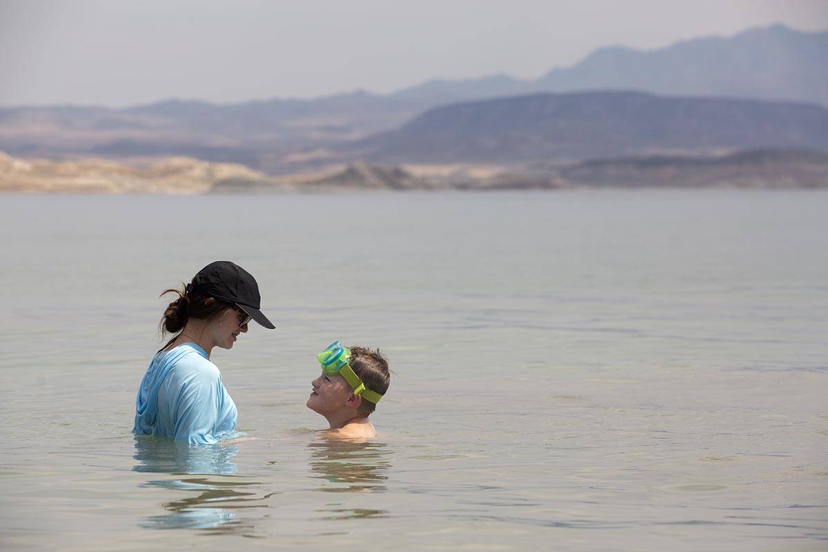 Emma Pratt, 14, and her brother Noah Pratt, 5, of Mississippi, cool off in the water along Boul ...