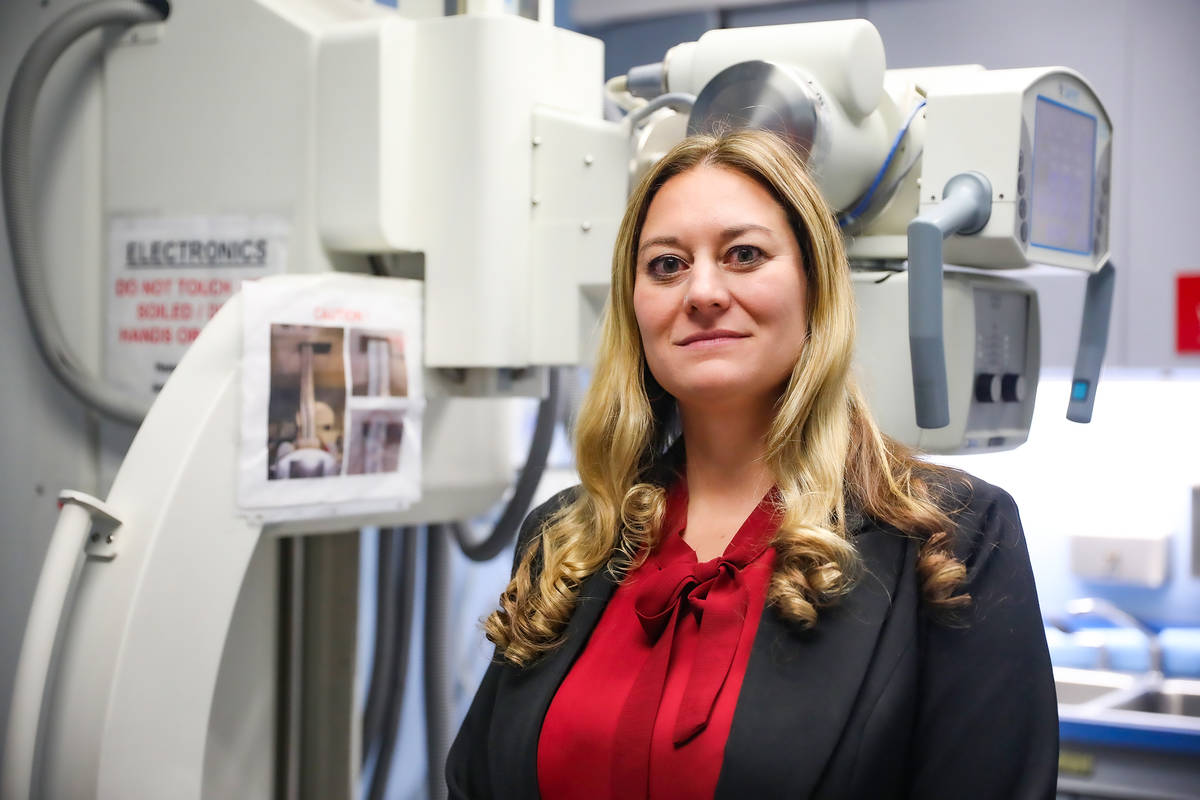 Clark County Coroner Melanie Rouse next to the X-ray machine at the Clark County Coroner Office ...