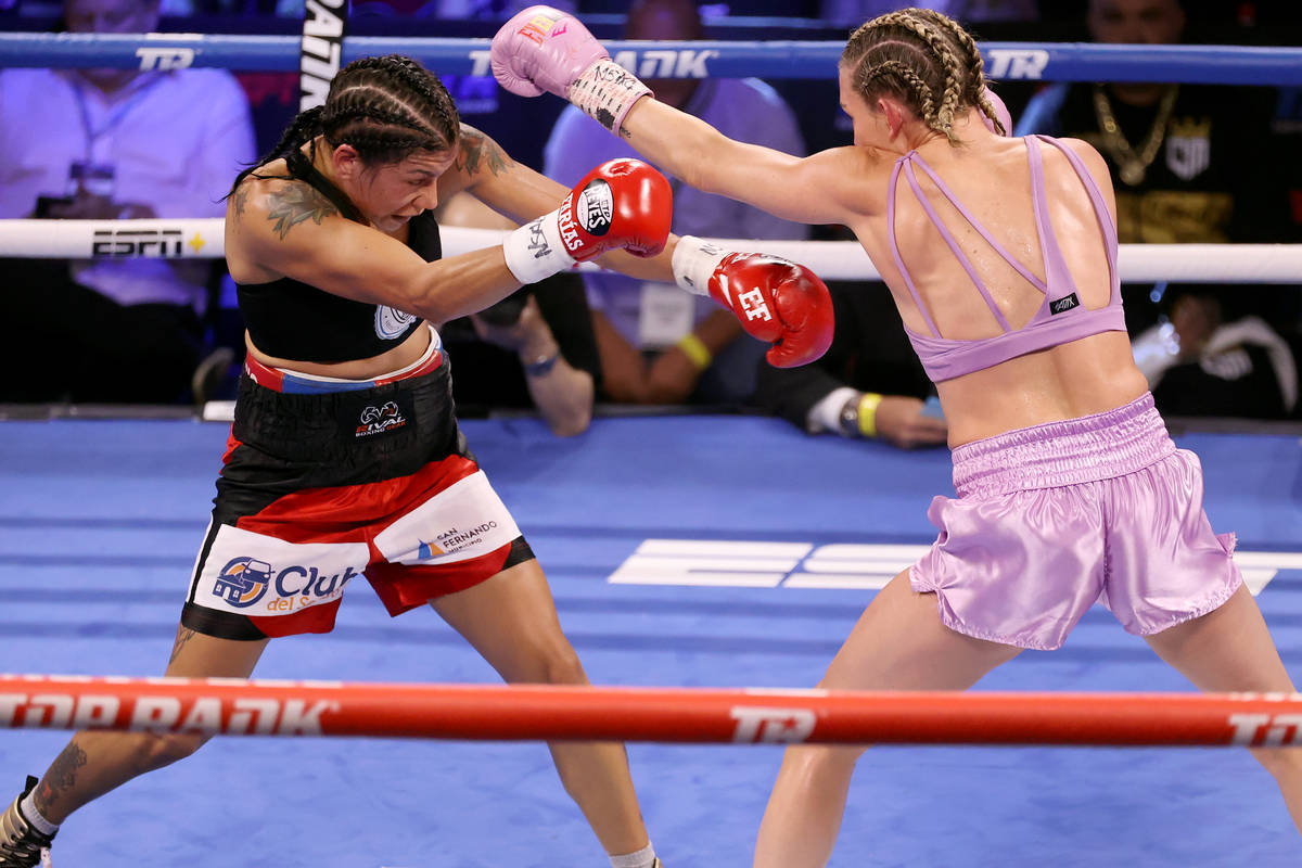 Mikaela Mayer, right, throws a punch against Erica Farias in the fifth round of the WBO Female ...