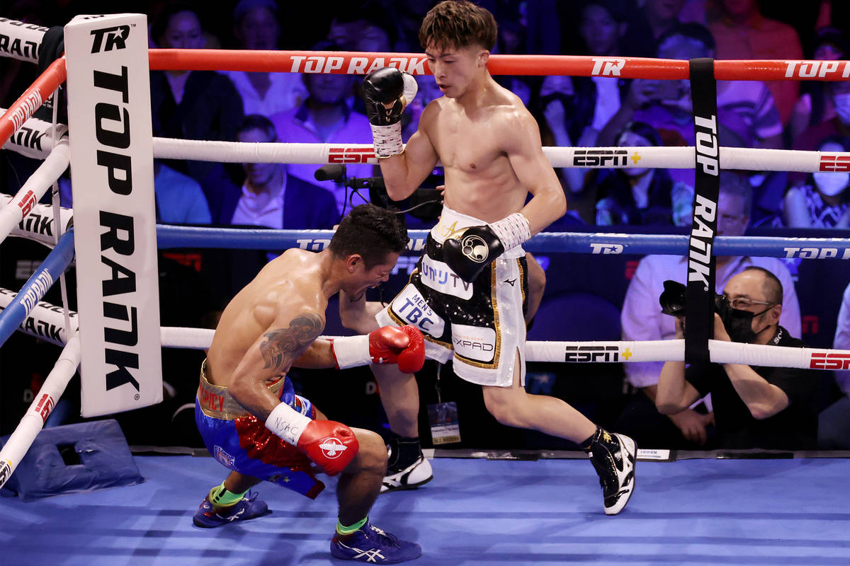 Naoya Inoue connects a body punch to knockout Michael Dasmarinas in the third round of the WBA ...