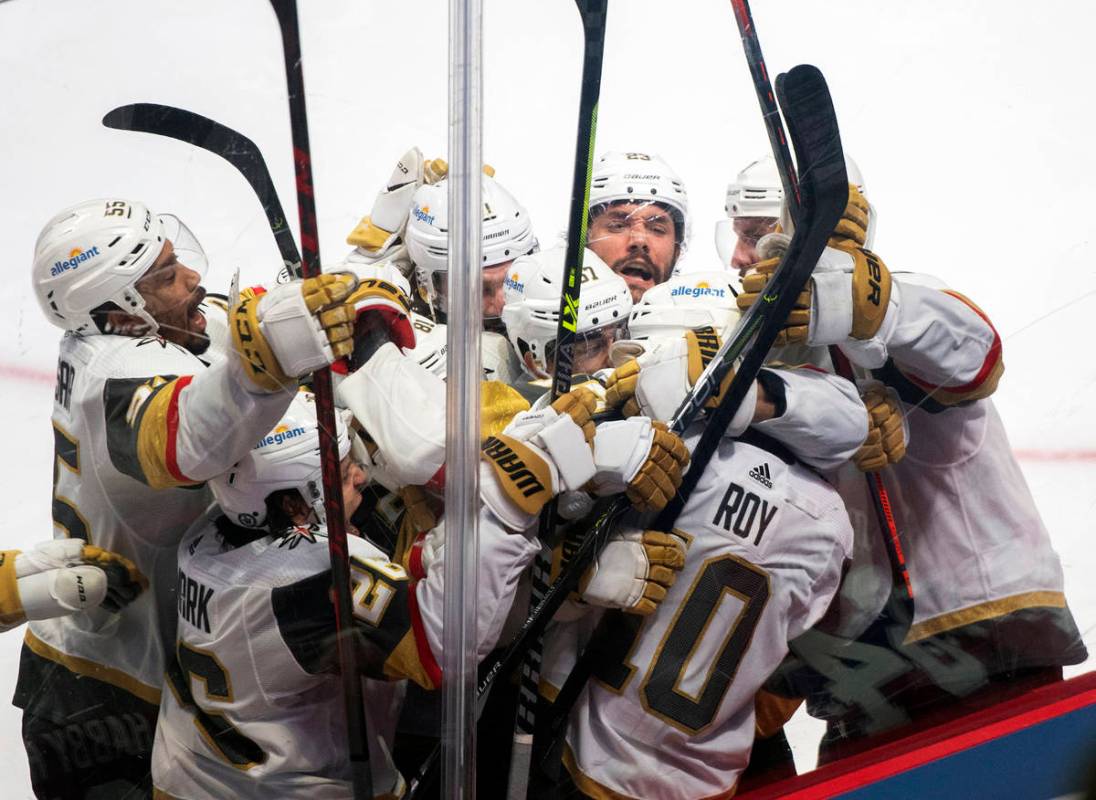 Vegas Golden Knights' Nicolas Roy (10) celebrates his game-winning goal against the Montreal Ca ...