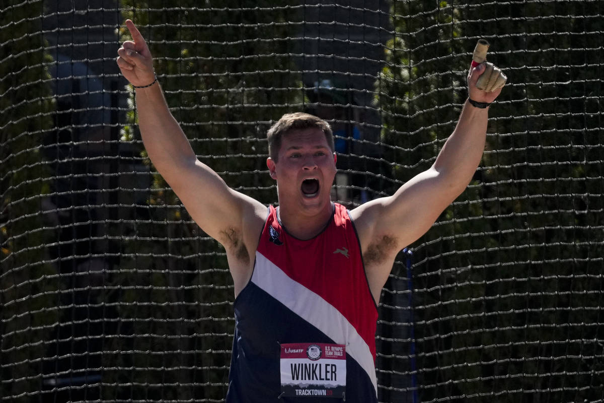 Rudy Winkler reacts after setting an American record during the finals of the men's hammer thro ...