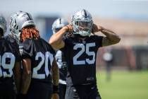 Raiders safety Tre'von Moehrig (25) puts his helmet on during the teamÕs NFL football prac ...