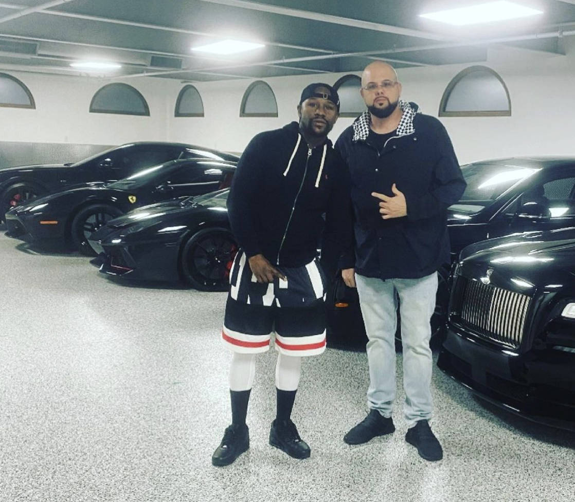 Floyd Mayweather poses with Josh “Chop” Towbin, the owner of Towbin Auto Group. The dealers ...