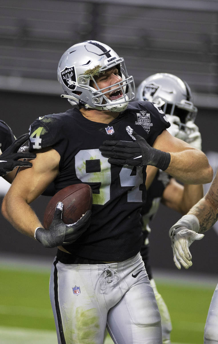 Las Vegas Raiders defensive end Carl Nassib (94) celebrates after intercepting a pass in the fo ...