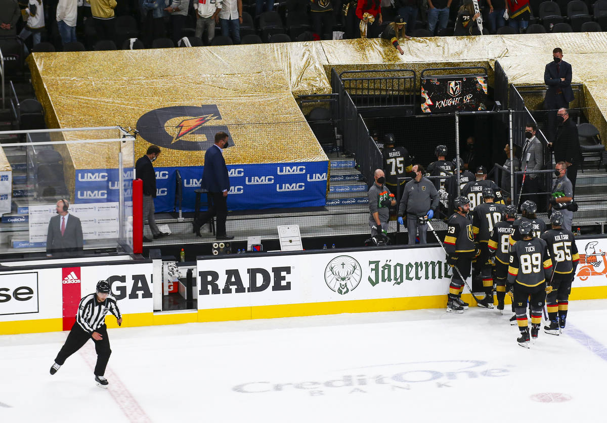 A referee skates by as the Golden Knights leave the ice following their loss to the Montreal Ca ...
