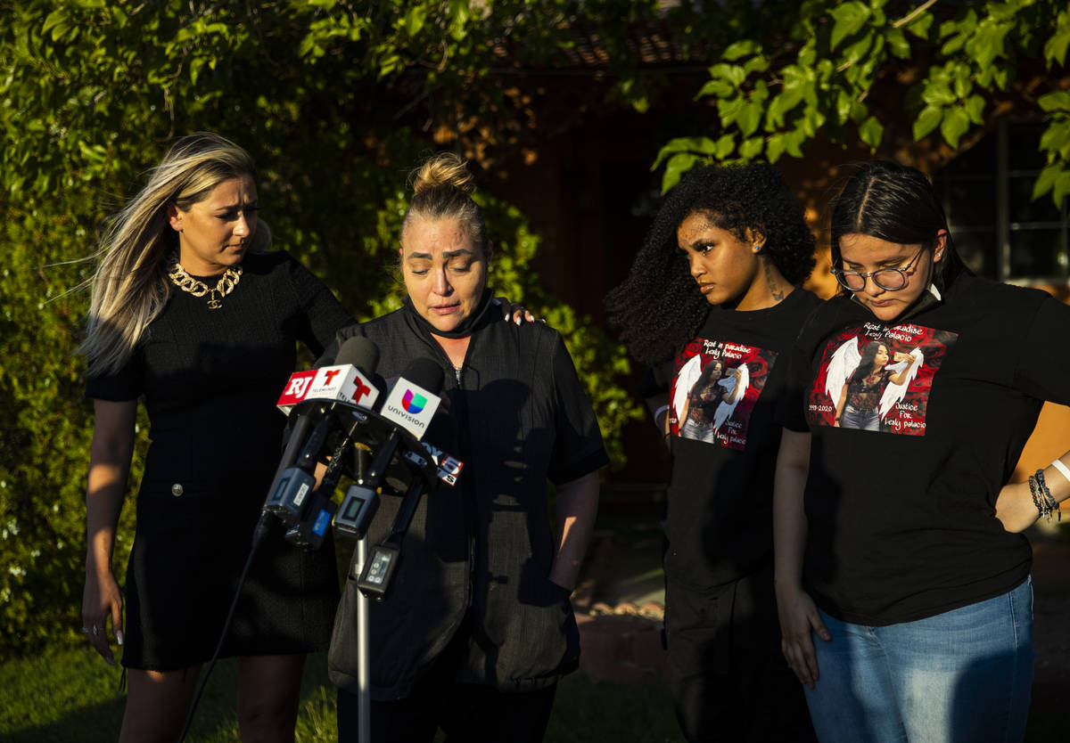 Aracely Palacio, second from left, is comforted by attorney Ofelia Markarian while speaking dur ...