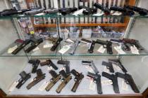 FILE - In this March 25, 2020, file photo semi-automatic handguns are displayed at shop in New ...