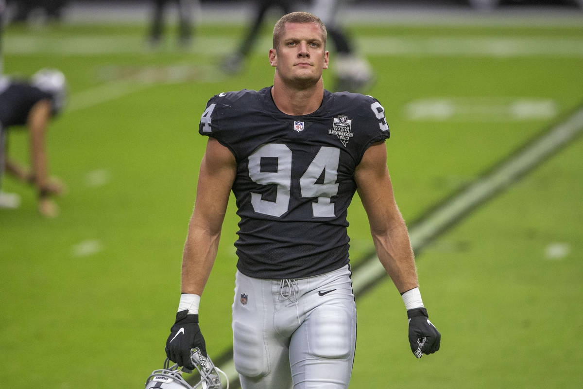 Las Vegas Raiders defensive end Carl Nassib (94) walks towards the sideline before an NFL footb ...