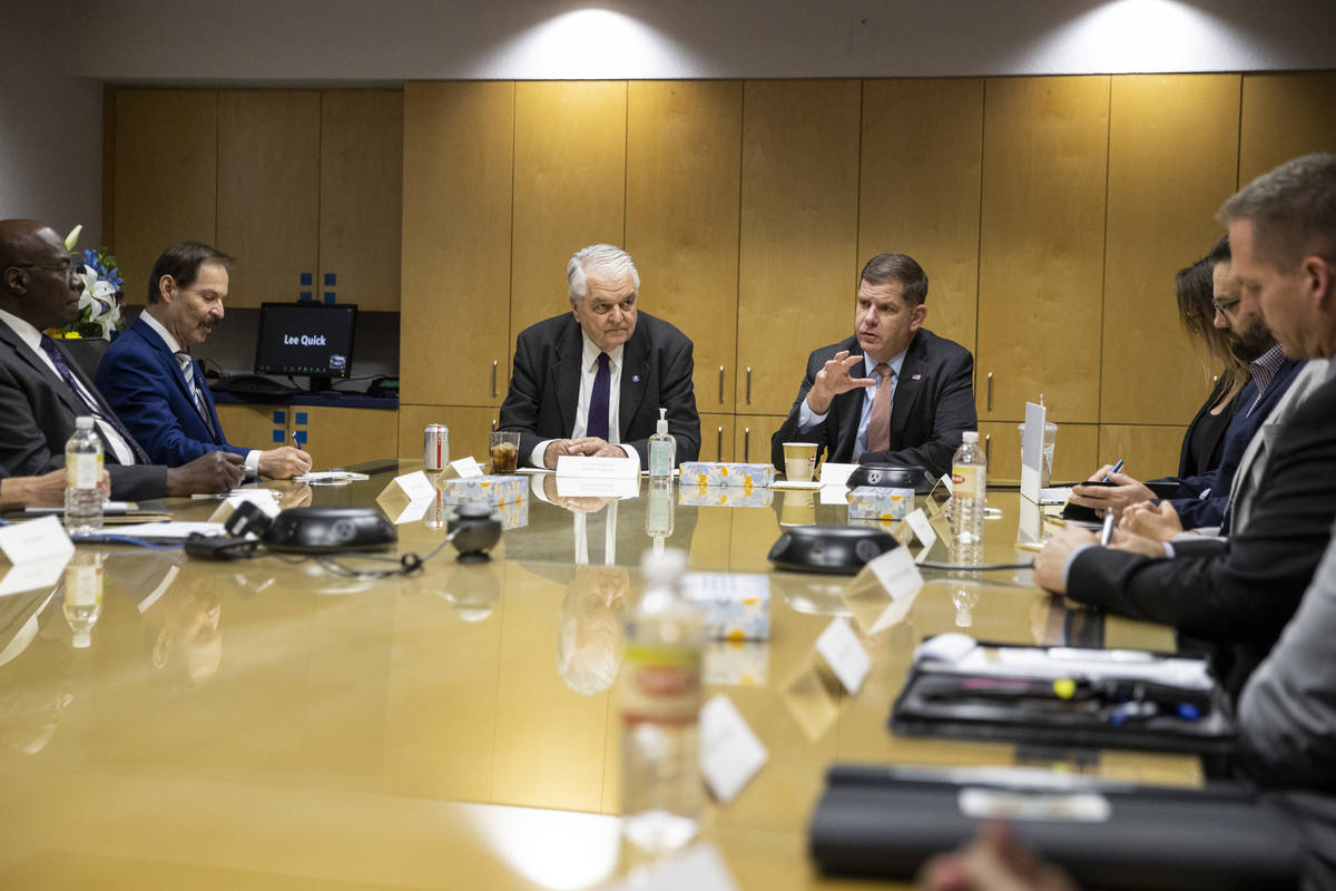 Nevada Gov. Steve Sisolak, left, and U.S. Labor Secretary Marty Walsh, participate during a rou ...