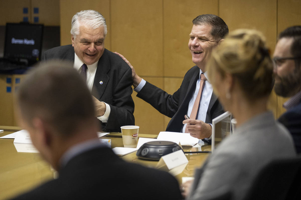 Nevada Gov. Steve Sisolak, left, and U.S. Labor Secretary Marty Walsh, participate during a rou ...