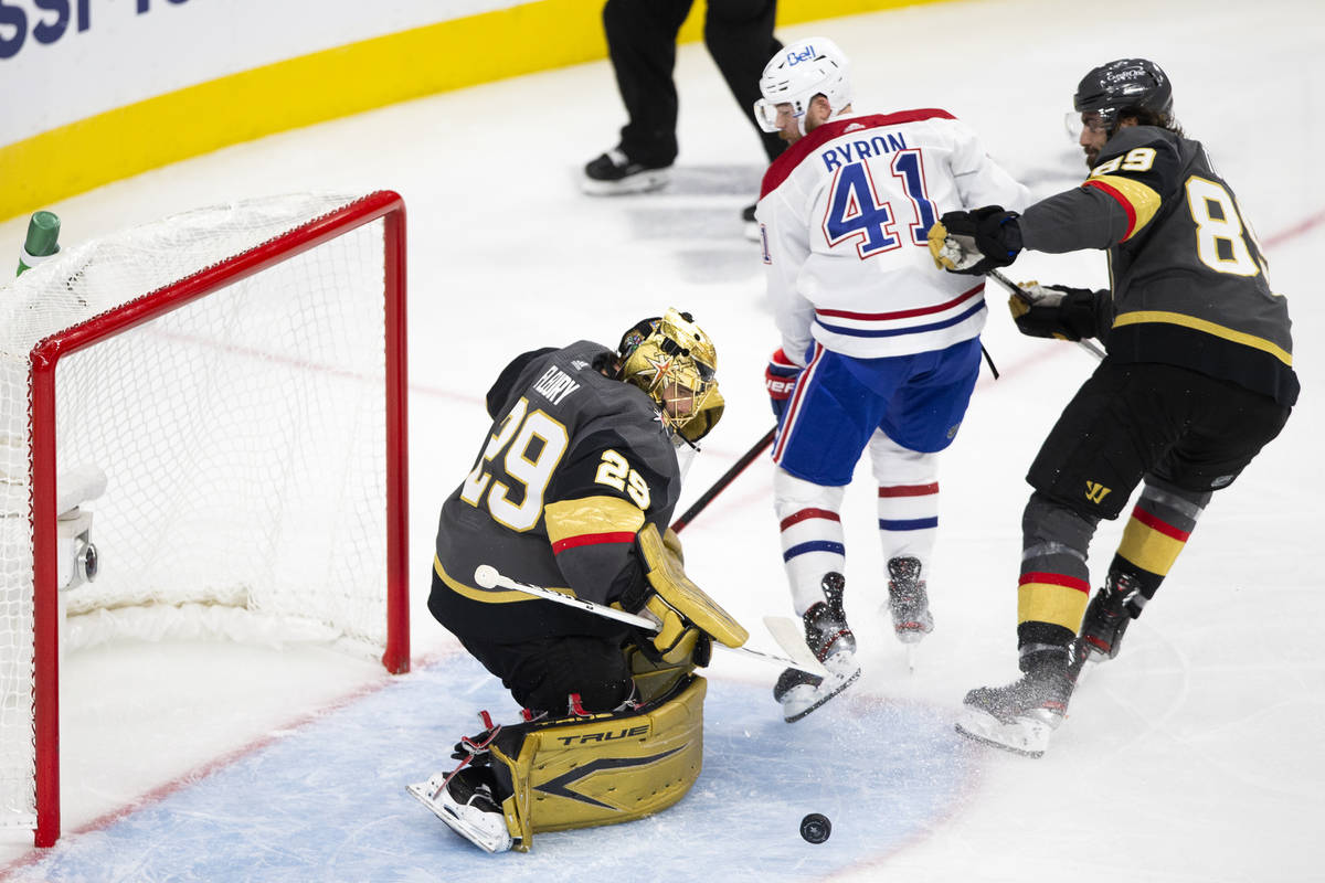 Golden Knights goaltender Marc-Andre Fleury (29) saves a shot by Canadiens right wing Paul Byro ...