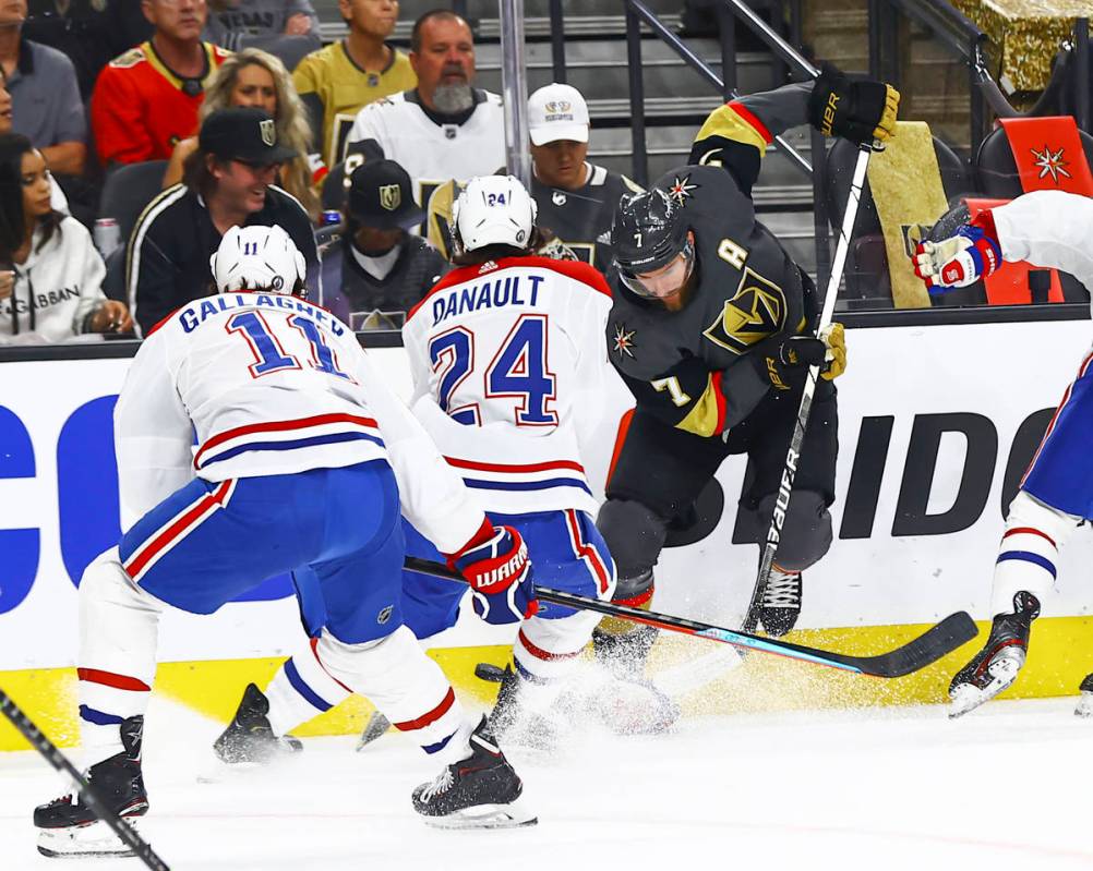 Golden Knights' Alex Pietrangelo (7) battles for the puck against Montreal Canadiens' Phillip D ...