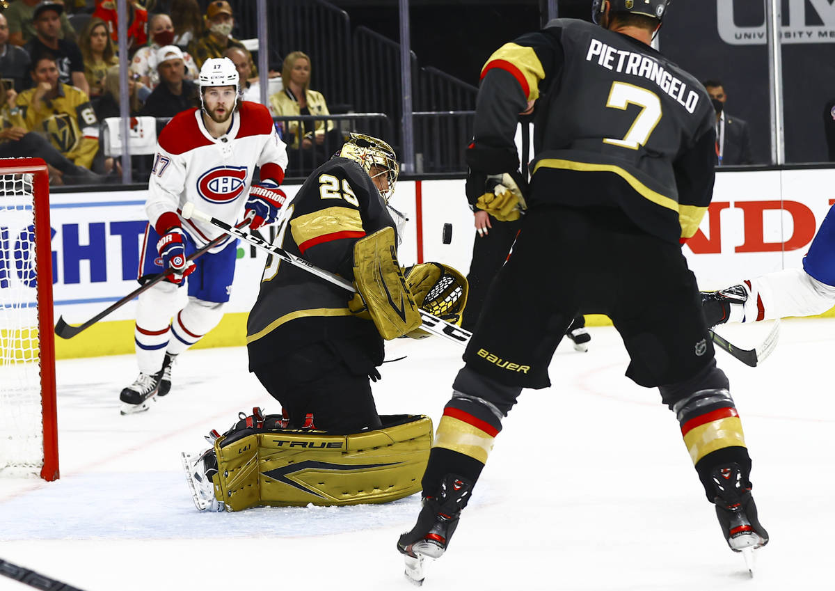 Golden Knights goaltender Marc-Andre Fleury (29) reaches out to stop the puck in front of the M ...