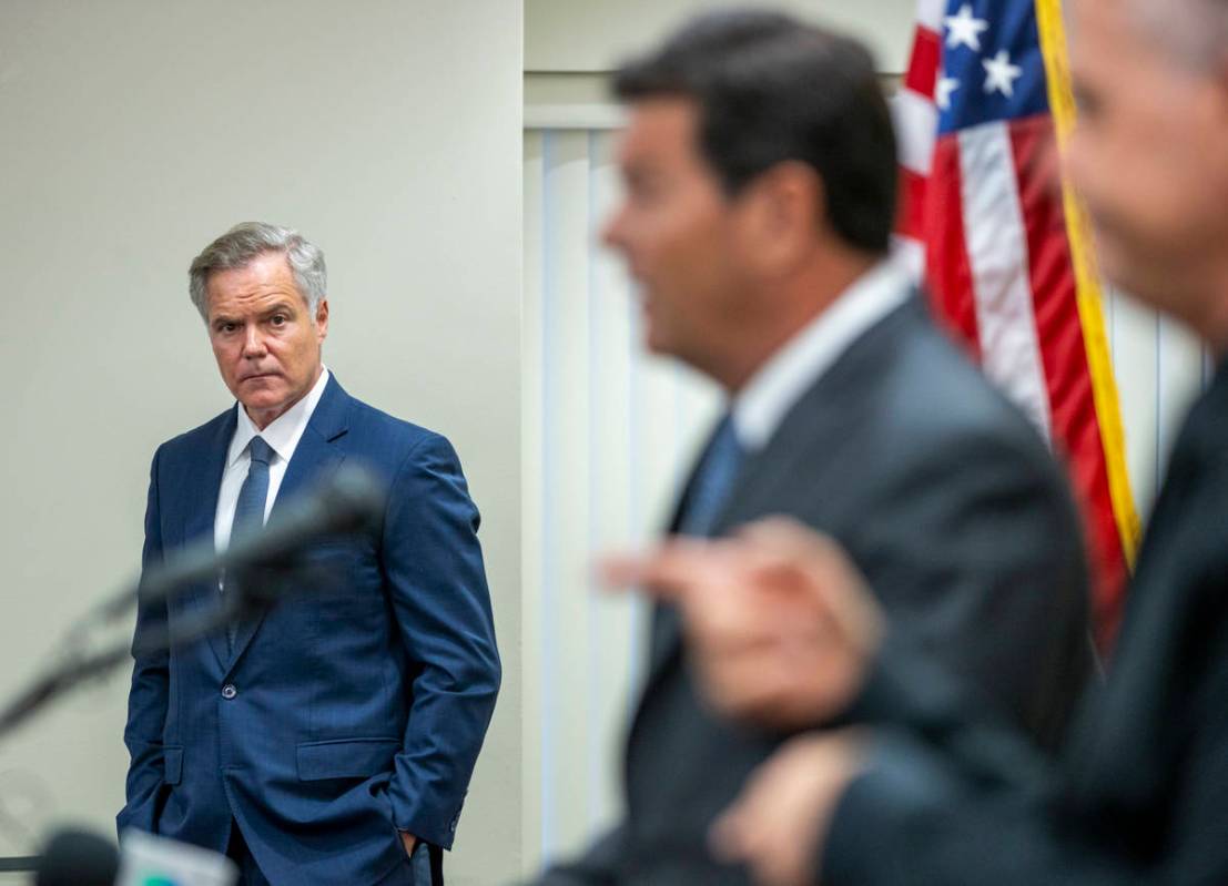 The Nevada COVID-19 Response, Relief and Recovery Task Force Chairman Jim Murren, left, looks o ...