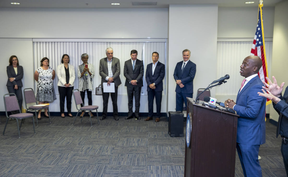 The Nevada COVID-19 Response, Relief and Recovery Task Force board member Alex Dixon, right, sp ...