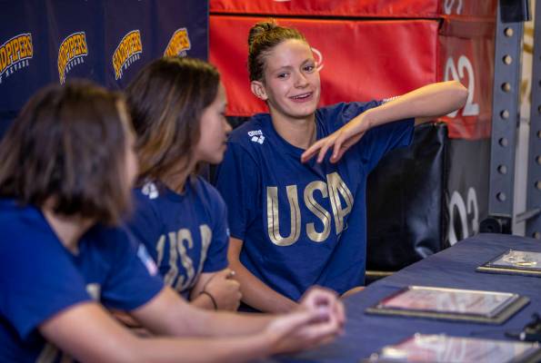 Sandpipers of Nevada Olympic swim team member Katie Grimes, right, answers a media question bes ...