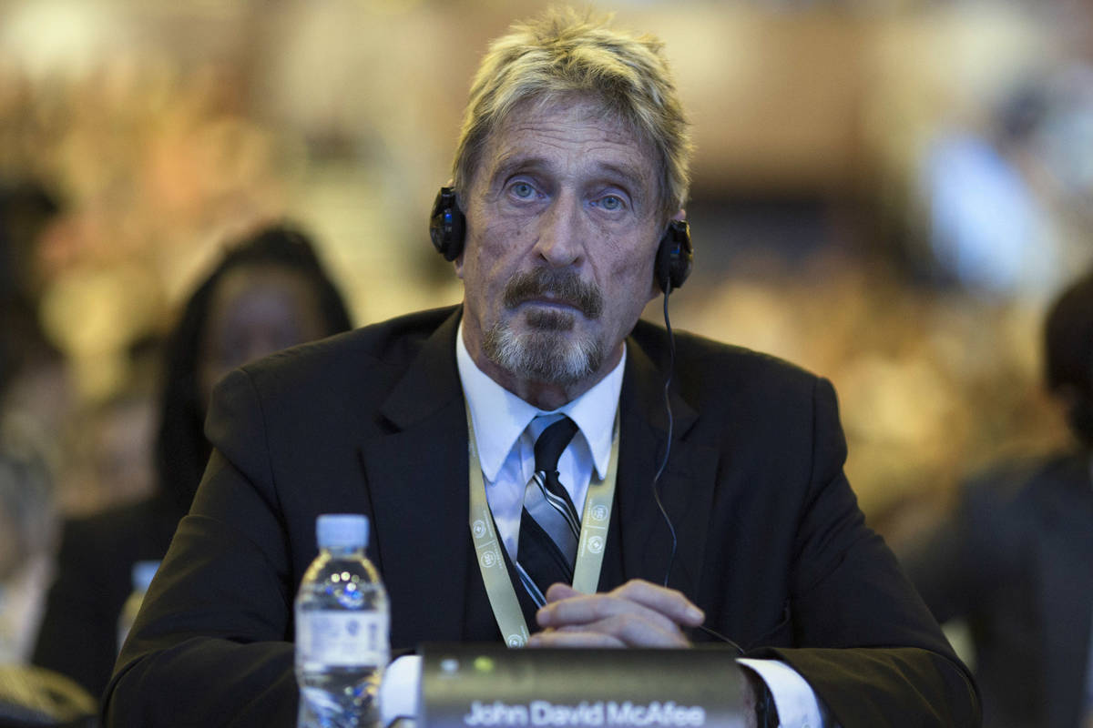 FILE - In this Tuesday, Aug. 16, 2016 file photo, software entrepreneur John McAfee listens dur ...