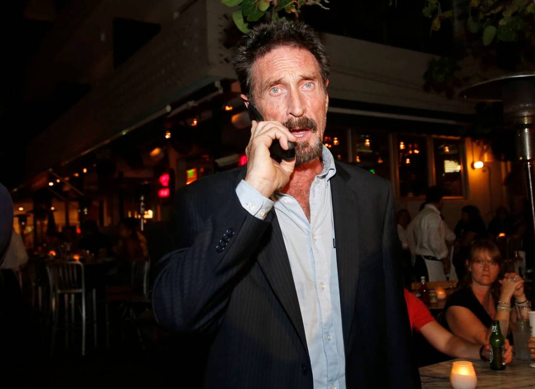 FILE - In this Dec 12, 2012 file photo, anti-virus software founder John McAfee talks on his mo ...